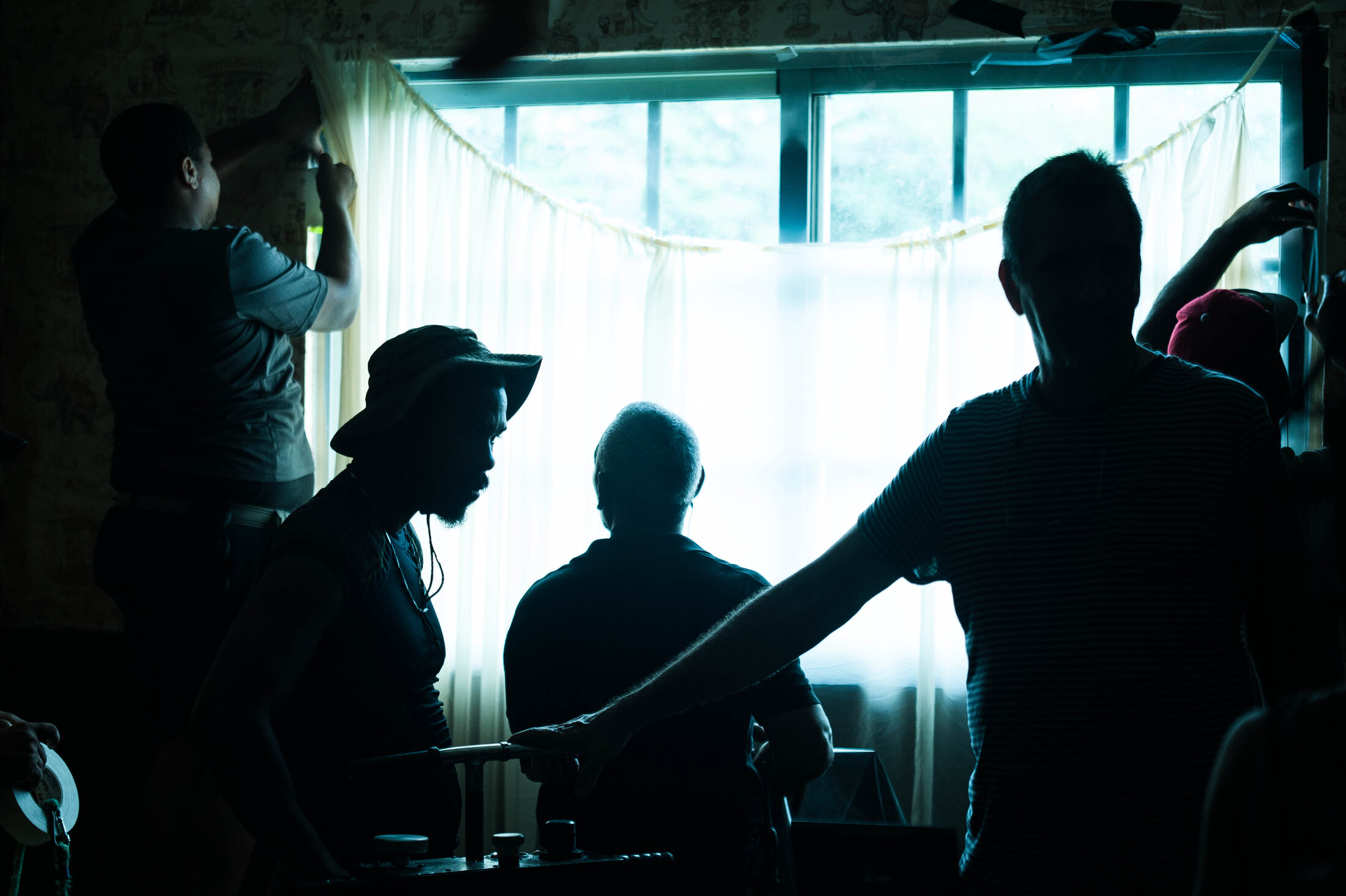 Crew members shape a window scene on the Kintsugi set